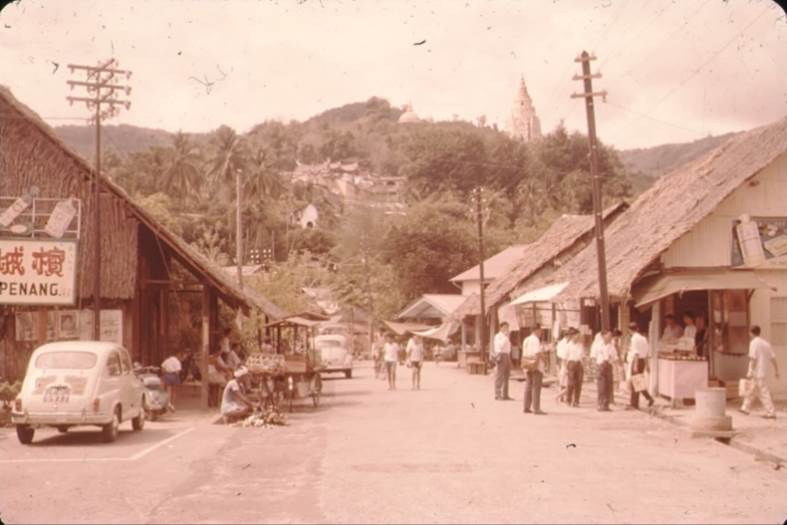 A picture containing text, outdoor, old, street
Description automatically generated